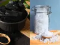 Charbon et gros sel, deux absorbeurs d'humidité naturels. Le charbon en morceaux et en poudre dans un bol, le sel dans un bocal en verre.