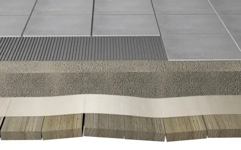 Coupe d'un sol : chape allégée sur plancher bois, avec carrelage et sous-couche drainante.