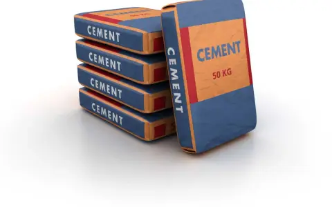 Pile de sacs de ciment de 50 kg, prêts pour le dosage béton dans une bétonnière.