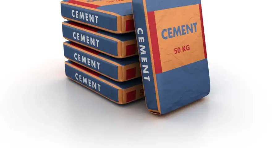 Pile de sacs de ciment de 50 kg, prêts pour le dosage béton dans une bétonnière.