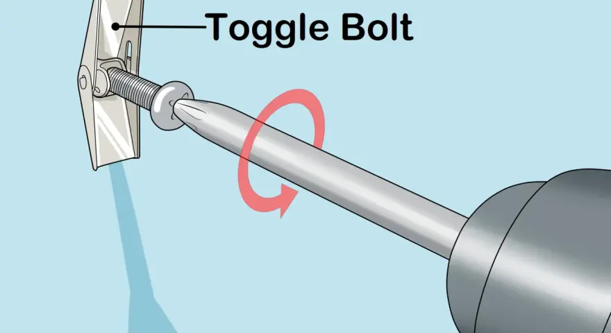Utilisation d'un boulon à bascule pour accrocher un miroir au mur. La vis est insérée dans le mur et le mécanisme à bascule s'ouvre derrière la cloison sèche.